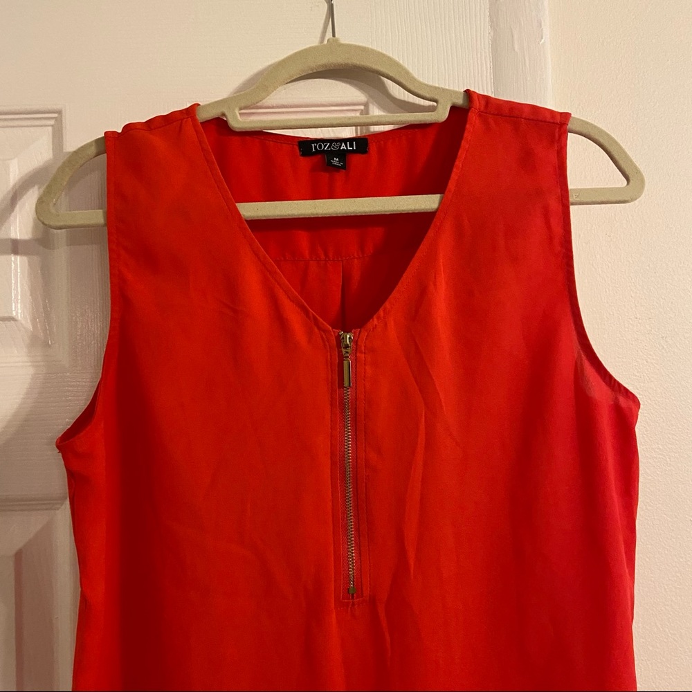 Orange/red sleeveless blouse